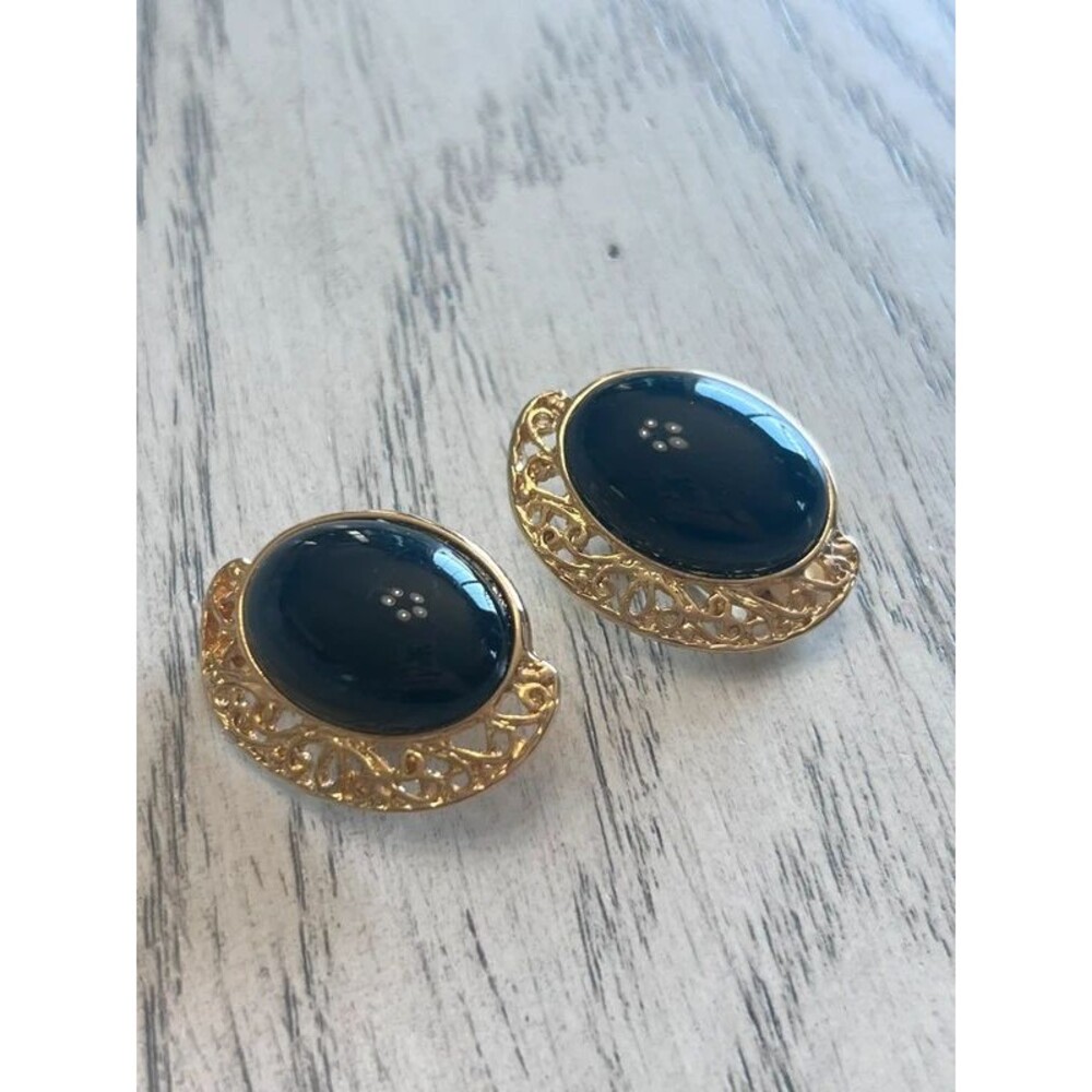 Vintage gold tone clip-on earrings black oval cabochon center filigree frame